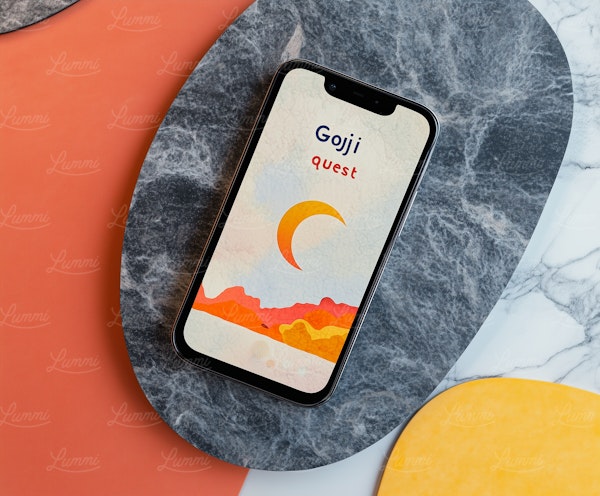 Smartphone on Marble with Goji Quest Graphic